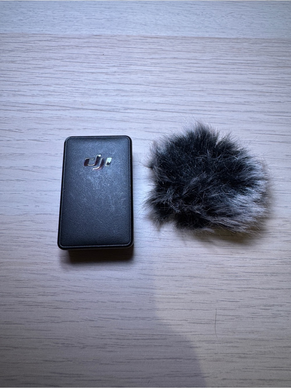 DJI Mic 1 transmitter and Gray Furry Wind Muff
